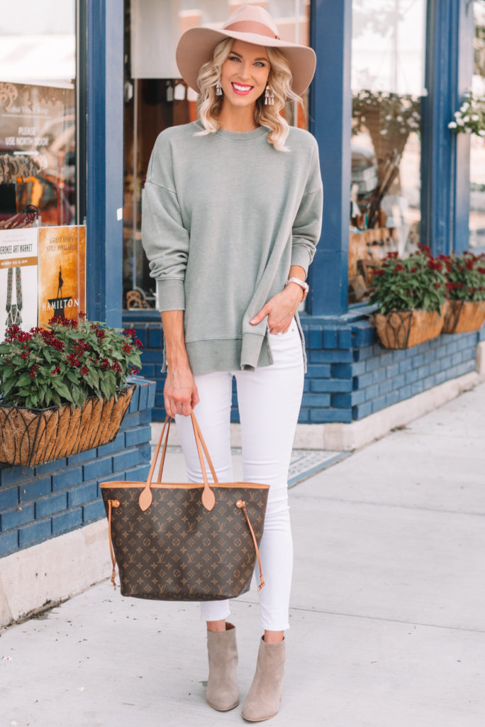 side slit pullover with white jeans and boots, cozy fall outfit, neutral fall outfit