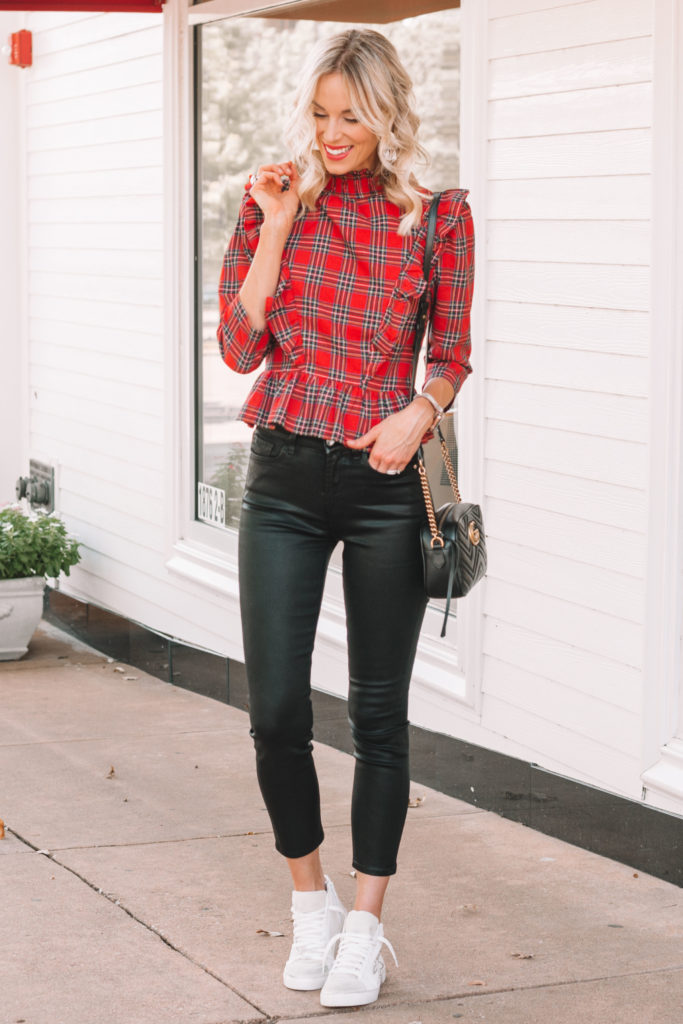 black coated jeans and red plaid ruffle top