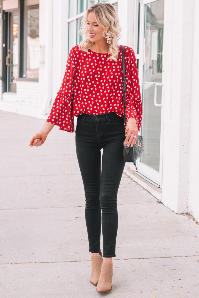 red blouse with black jeans and tan boties