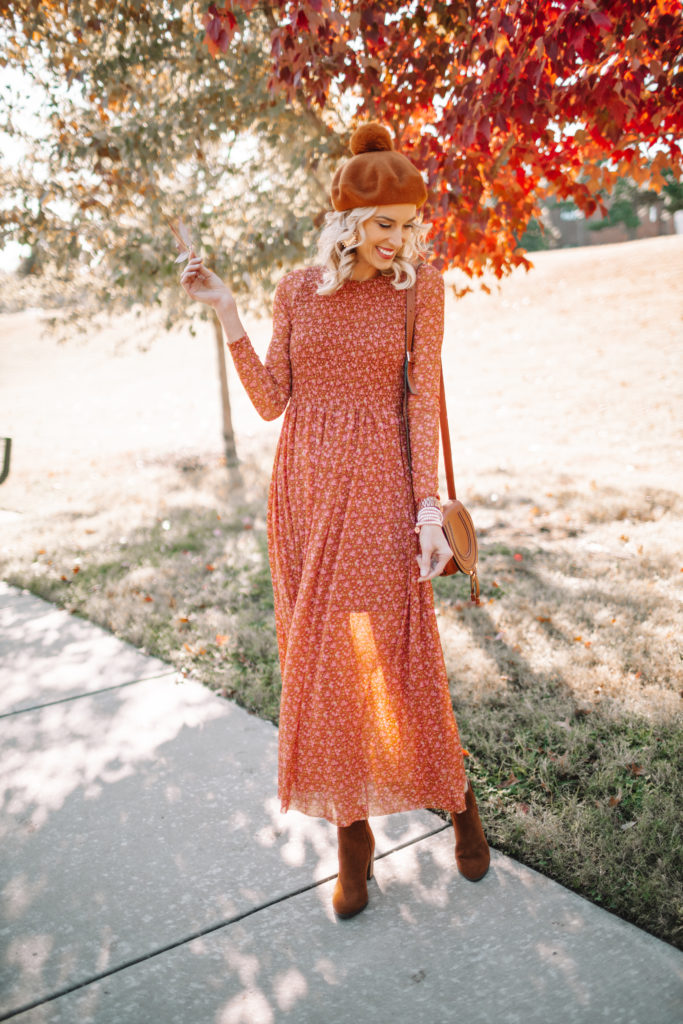 orange and red colored fall midi dress and boots with beret