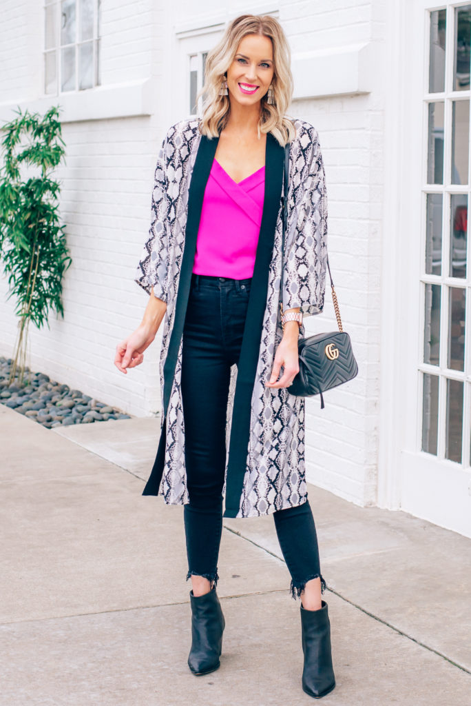 hot pink cami with black jeans and snakeskin duster