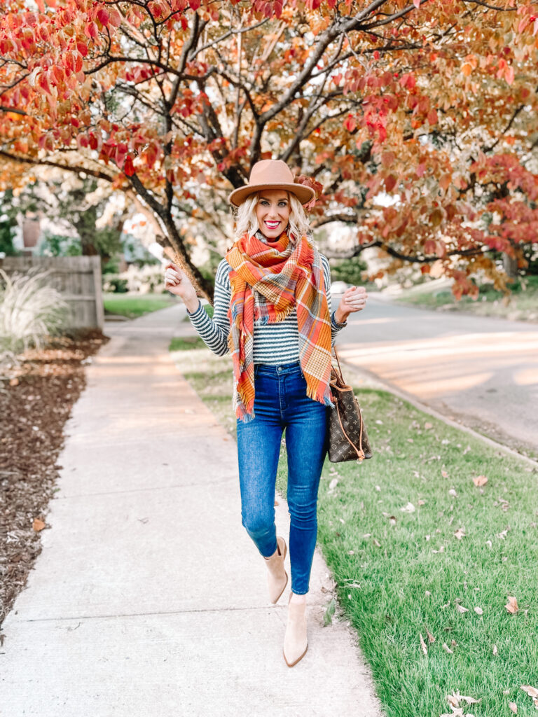 My favorite fall outfit! This striped sweater with a gorgeous fall colored scarf is perfect. 