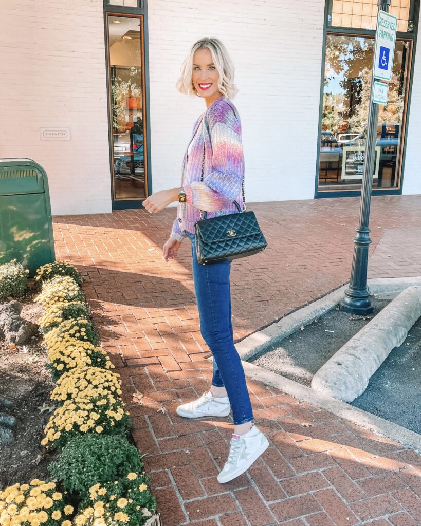 I am obsessed with this short colorful cardigan for fall!!! This shorter style with the large buttons is really having a moment this year.