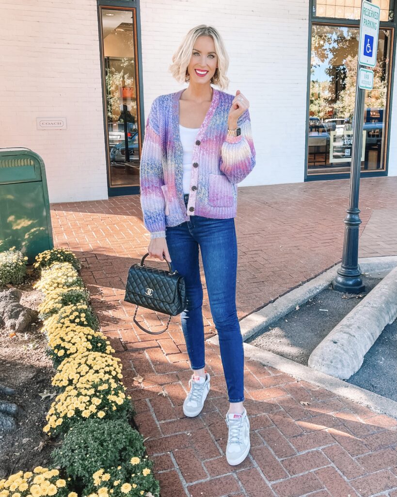 I am obsessed with this short colorful cardigan for fall!!! This shorter style with the large buttons is really having a moment this year. I love it styled casually with jeans and sneakers.