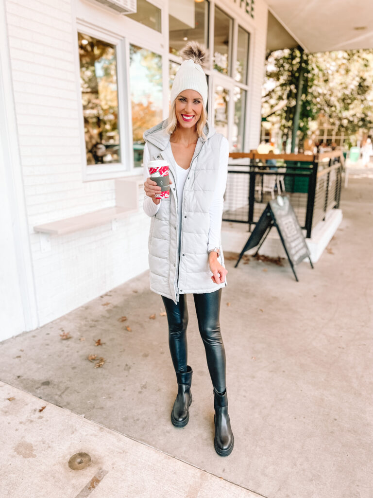 I love pairing my combat boots with black leggings and casual tops like this long puffer vest. Click to read more tips on how to wear combat boots.
