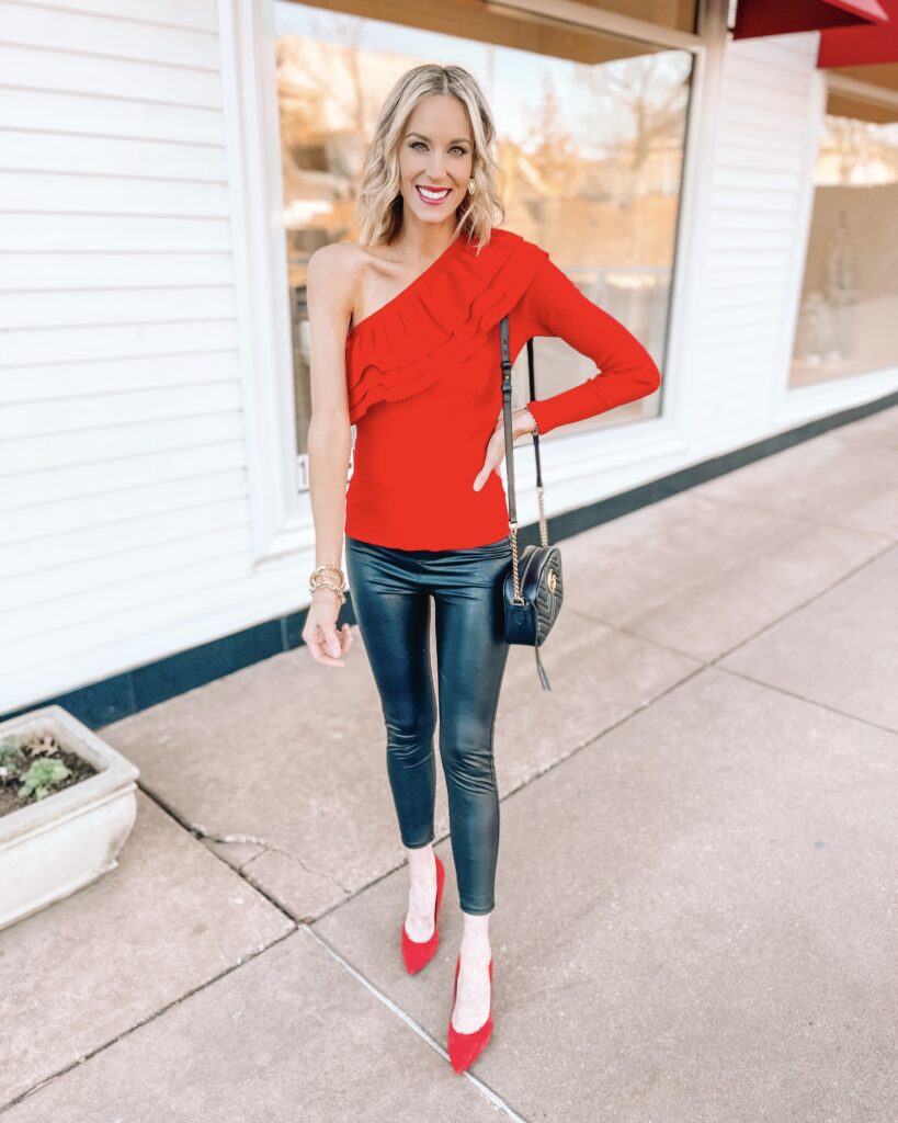 I love this one shoulder ruffle sleeve red top with leather pants and red heels for a fun Valentine's date night outfit idea. Just add jewelry and go!