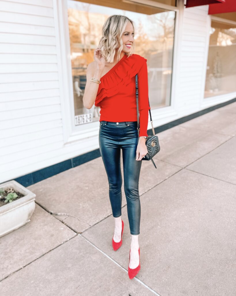 Coming at you today with a really fun Valentine's Day outfit idea! This $27 one shoulder ruffle sleeve red top is perfect with leather pants for a fun night out!