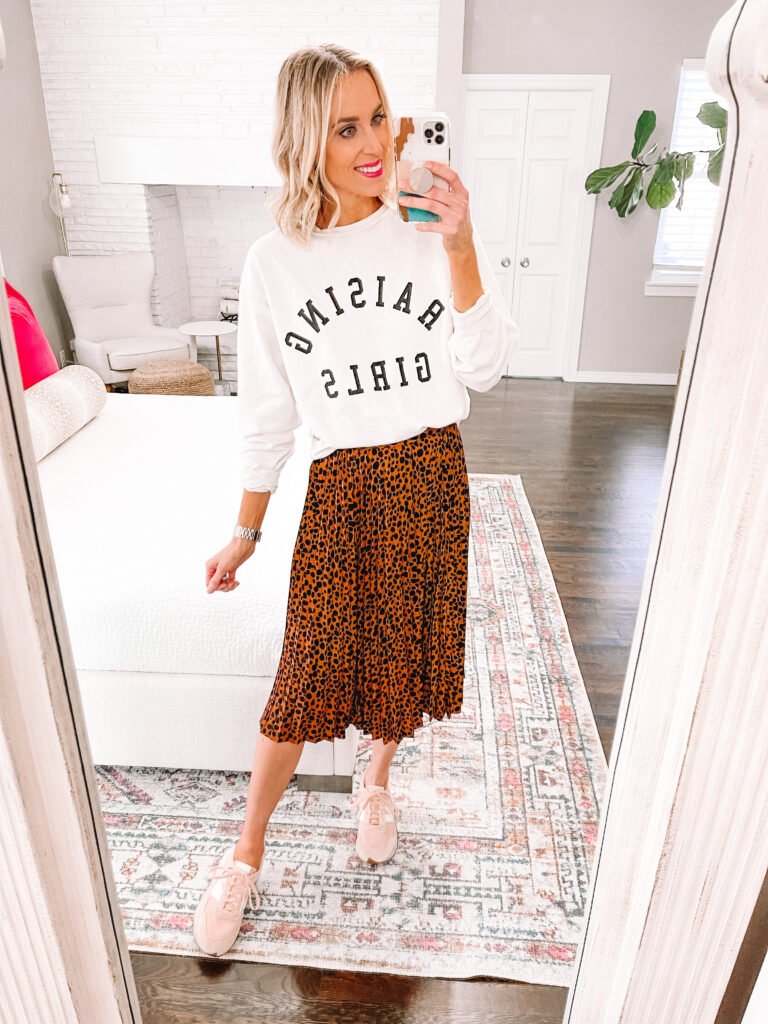 Have a midi skirt in your closet that needs some love? They are so versatile! I'm sharing 5 ways to wear a leopard midi skirt including this mom friendly look. Just add a sweatshirt and sneakers!