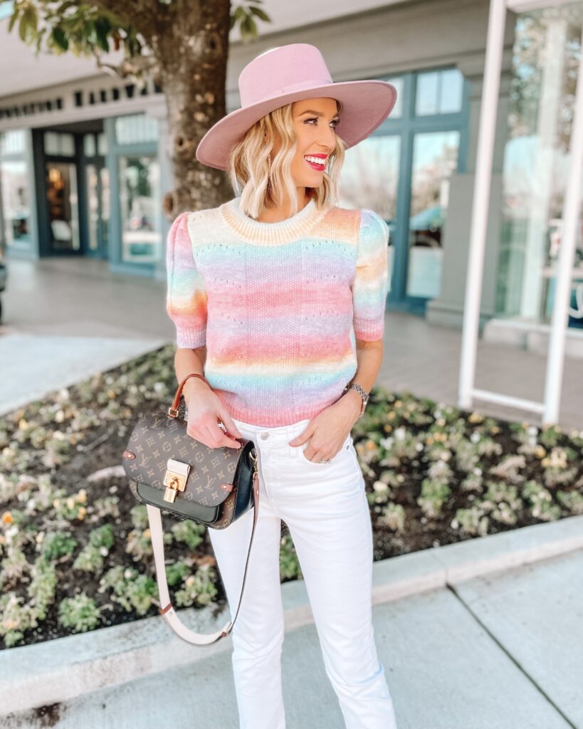 I love this rainbow colored short sleeve sweater for spring! I paired it with white jeans and a pink fedora hat for a fun, easy outfit!