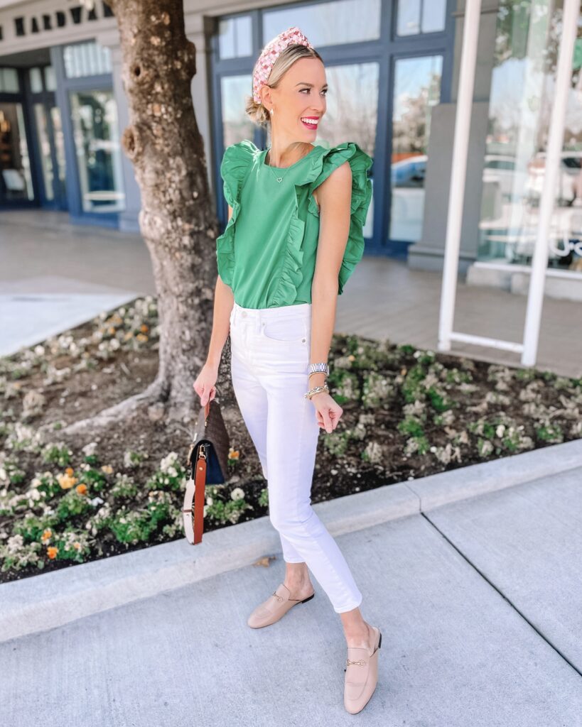 When spring hits, I love wearing white. It just feels so fresh! Today I am sharing how to wear white jeans in spring including 13 outfits and 4 no fail combos to try like this bold green top. 