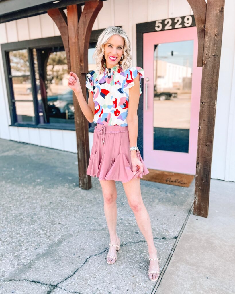 This gorgeous blouse is so fun and versatile with the multicolored print. Today I am sharing how to style this spring blouse two ways, once with a skirt and once with jeans.