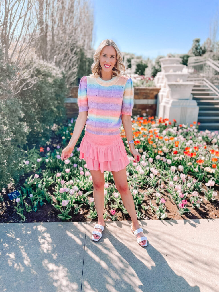 I'm newly obsessed with skorts and working on a collection! Today I am sharing how to style a skort and four cute skort options! This pink skirt is my favorite ting I own especially when paired wit this rainbow sweater.