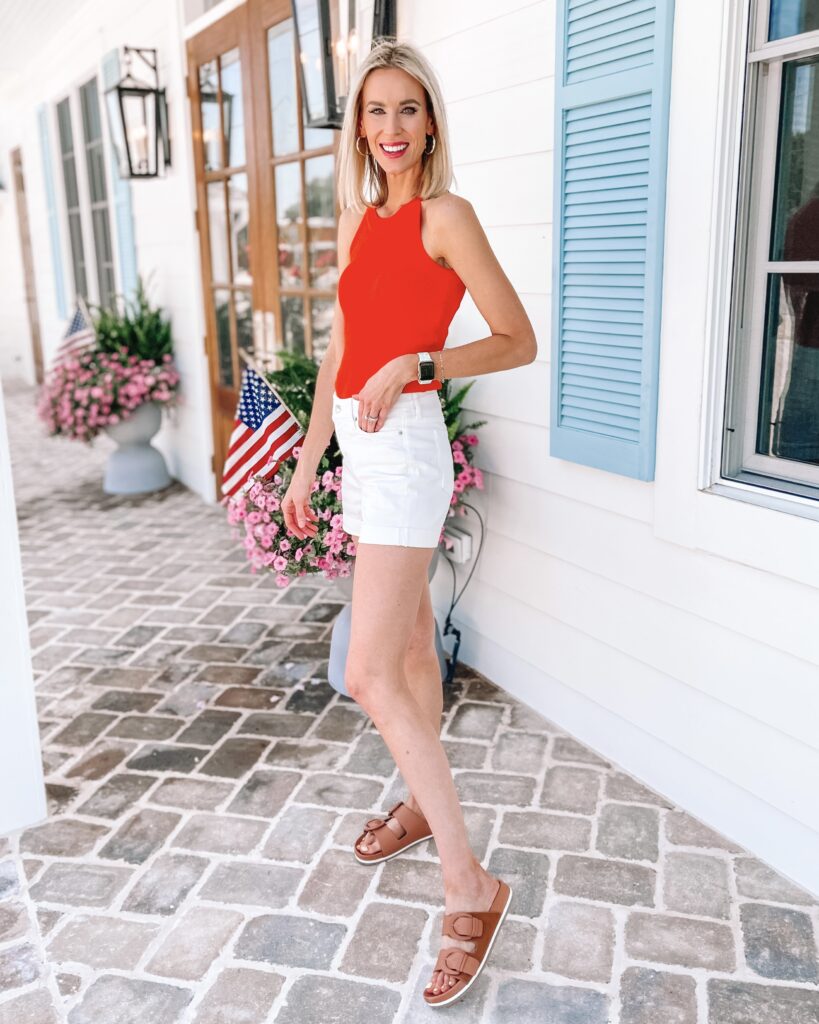 Gosh I love these $18 shorts, and they have gotten so much wear! I'm rounding up 10 ways to wear white jean shorts all with affordable tops! I love the bold combo of this red tank!
