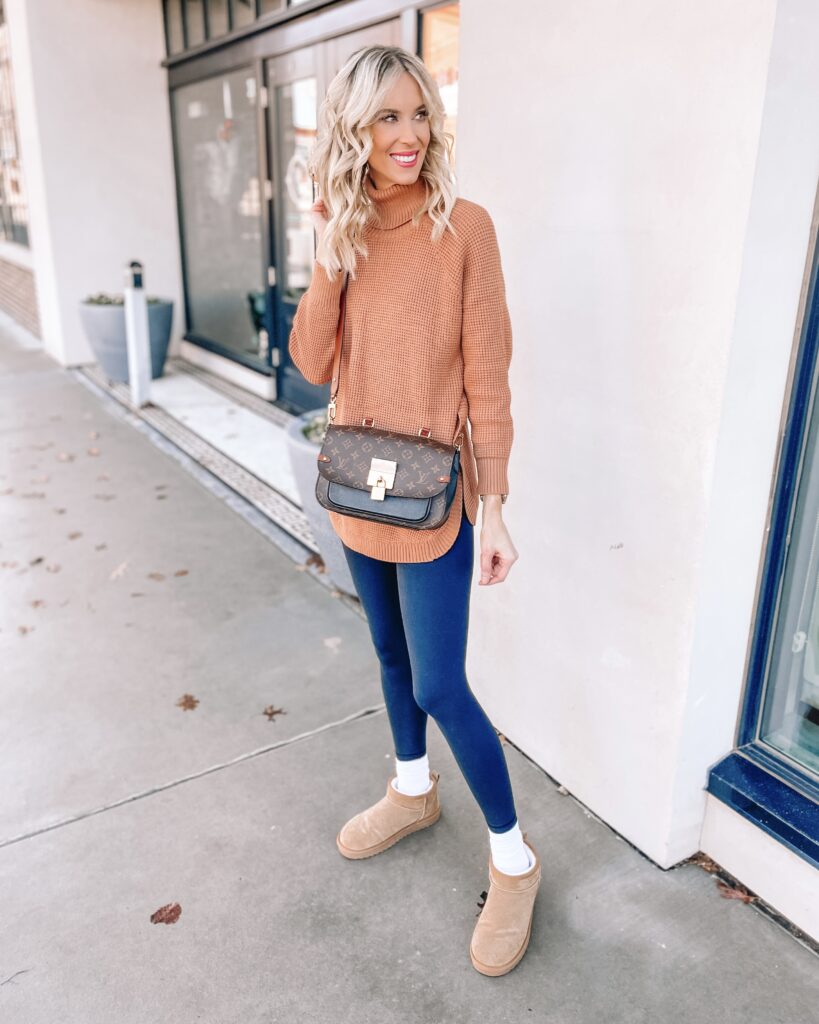 You'll love this Amazon casual outfit with the curved hem tunic sweater, lululemon lookalike leggings, and Ugg mini dupe boots. 