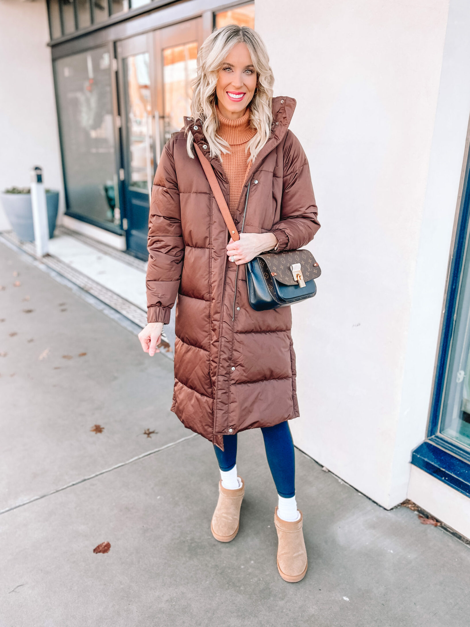 You'll love this Amazon casual outfit with the curved hem tunic sweater, lululemon lookalike leggings, and Ugg mini dupe boots. I added my brown puffer coat too!
