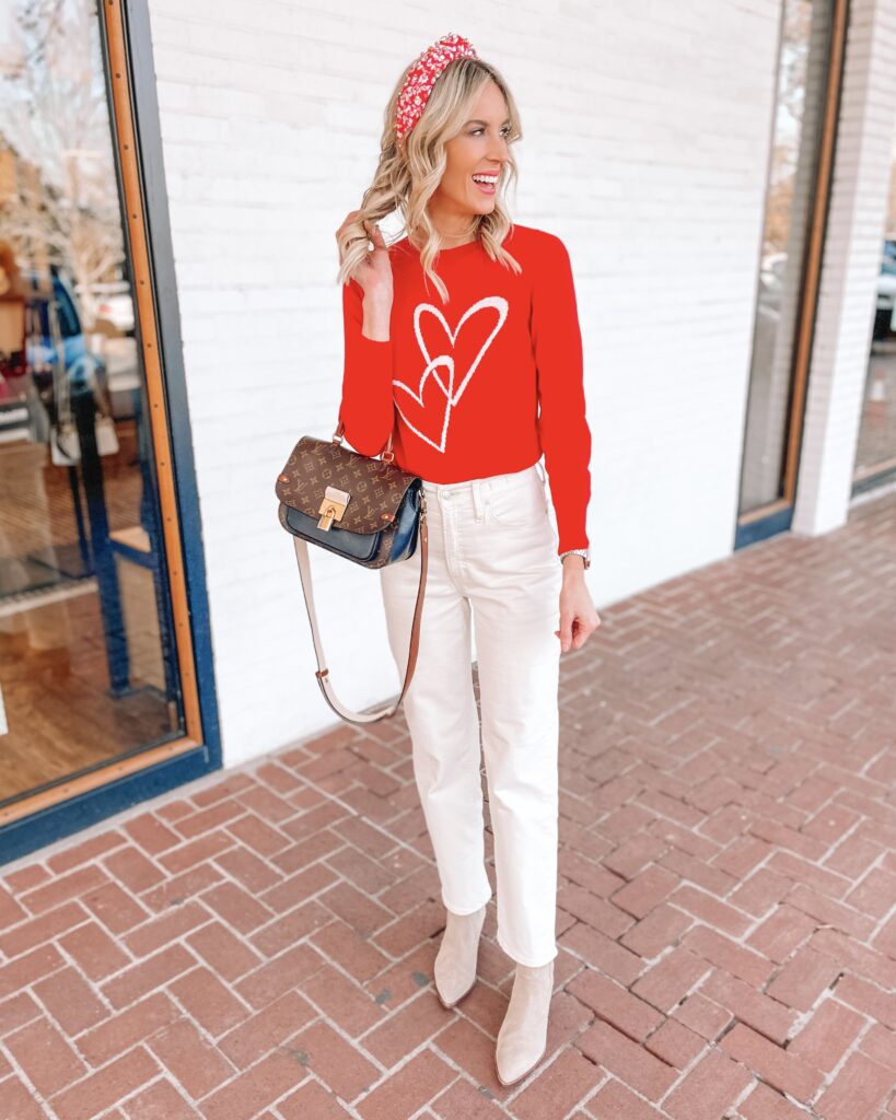 This Valentine's Day sweater with interlocking hearts is so fun with my cream jeans. 