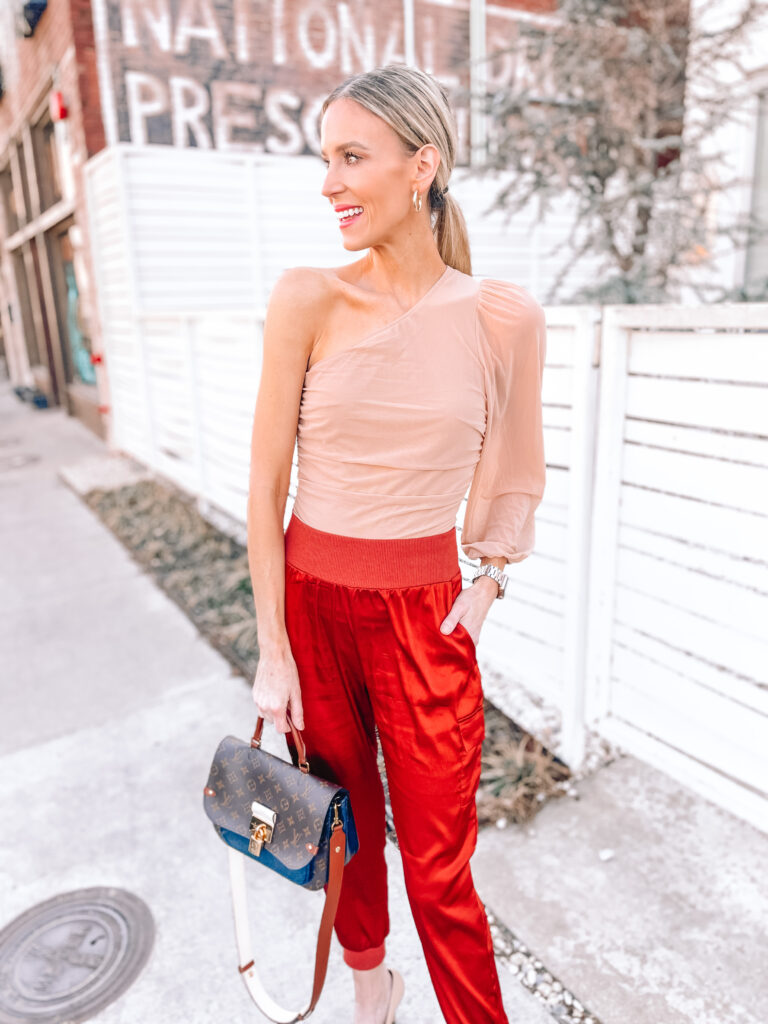 You'll love this Amazon date night outfit idea! Change things up with a one shoulder top and satin jogger pants. 