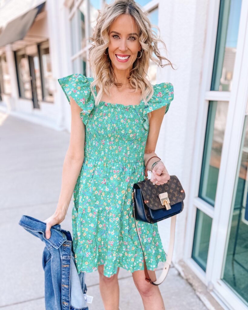 This green floral smocked dress with flutter sleeves is the perfect spring dress or vacation dress!