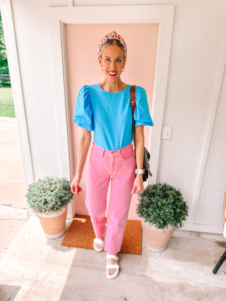 Have you noticed the new trend of colored jeans? It has been showing up everywhere lately in all shades and hues! You'll love these pink jeans paired with this blue top for a great colorful outfit.