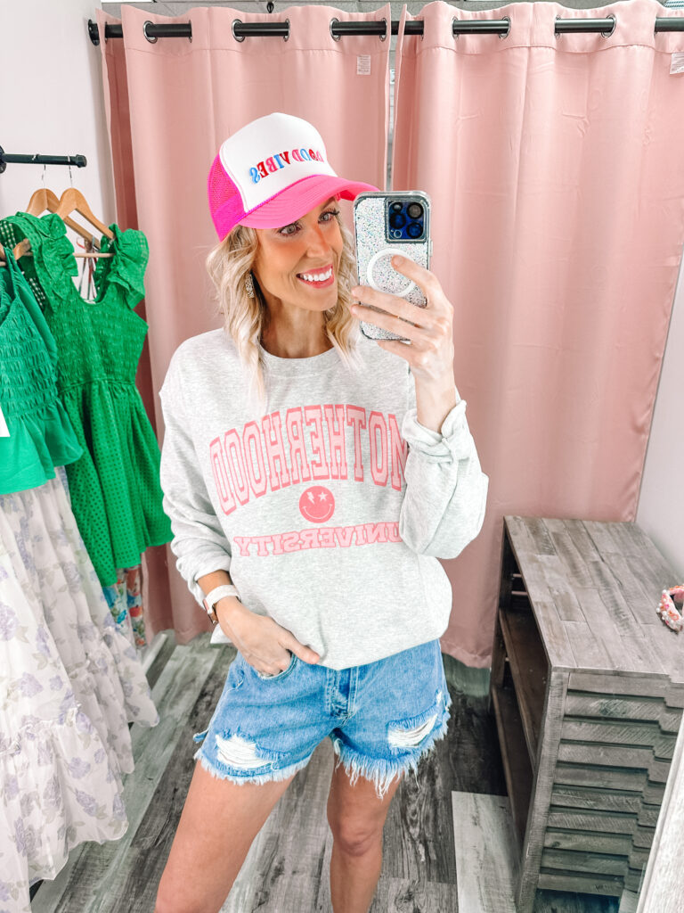 I'm excited to share a really fun Pink Creek try on haul with you today! Fun, colorful, and unique items all in the $40-$100 price range. I am loving this Motherhood sweatshirt and trucker hat combo.