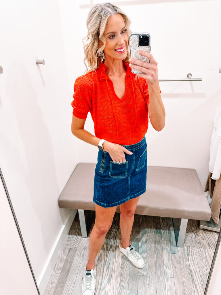 You guys I have a HUGE LOFT try on haul for you. I am talking HUGE. 13 fall outfits styled for you with business casual outfit ideas, fall family photo dresses, work to weekend looks, and more! This jean skirt with front pockets is so adorable with this reddish orange lightweight sweater. 
