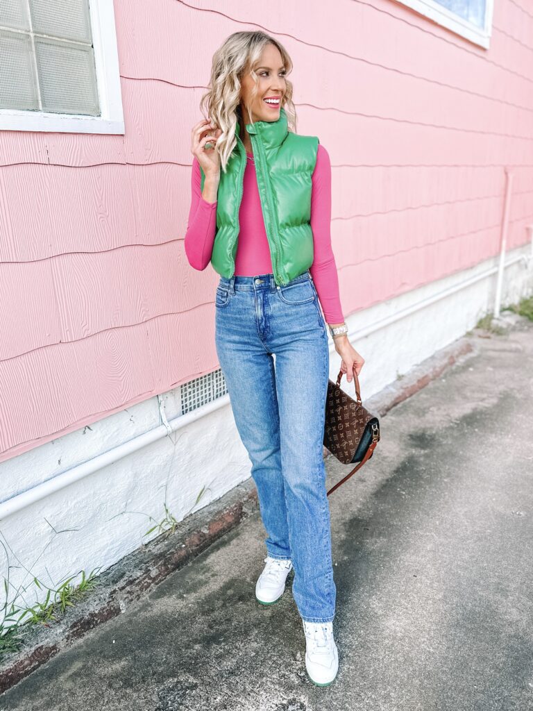 90s straight leg jeans are having a major moment, and I am here for it! I've been on the hunt for just the right pair, and the Madewell 90s straight leg jeans hit all marks! I styled mine with a bright pink long sleeve shirt, a green puffer vest, and my New Balance 550s. 