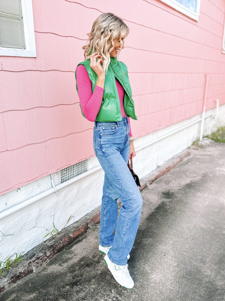 90s straight leg jeans are having a major moment, and I am here for it! I've been on the hunt for just the right pair, and the Madewell 90s straight leg jeans hit all marks! I styled mine with a bright pink long sleeve shirt, a green puffer vest, and my New Balance 550s. 