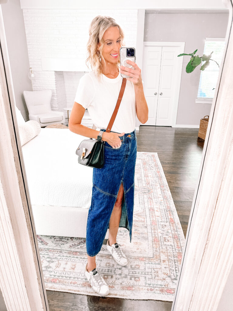 Wondering how to wear a long denim skirt? They are really trending and I'm sharing 4 easy ways to style them from dressy to casual. Keep it simple with sneakers and a t-shirt.