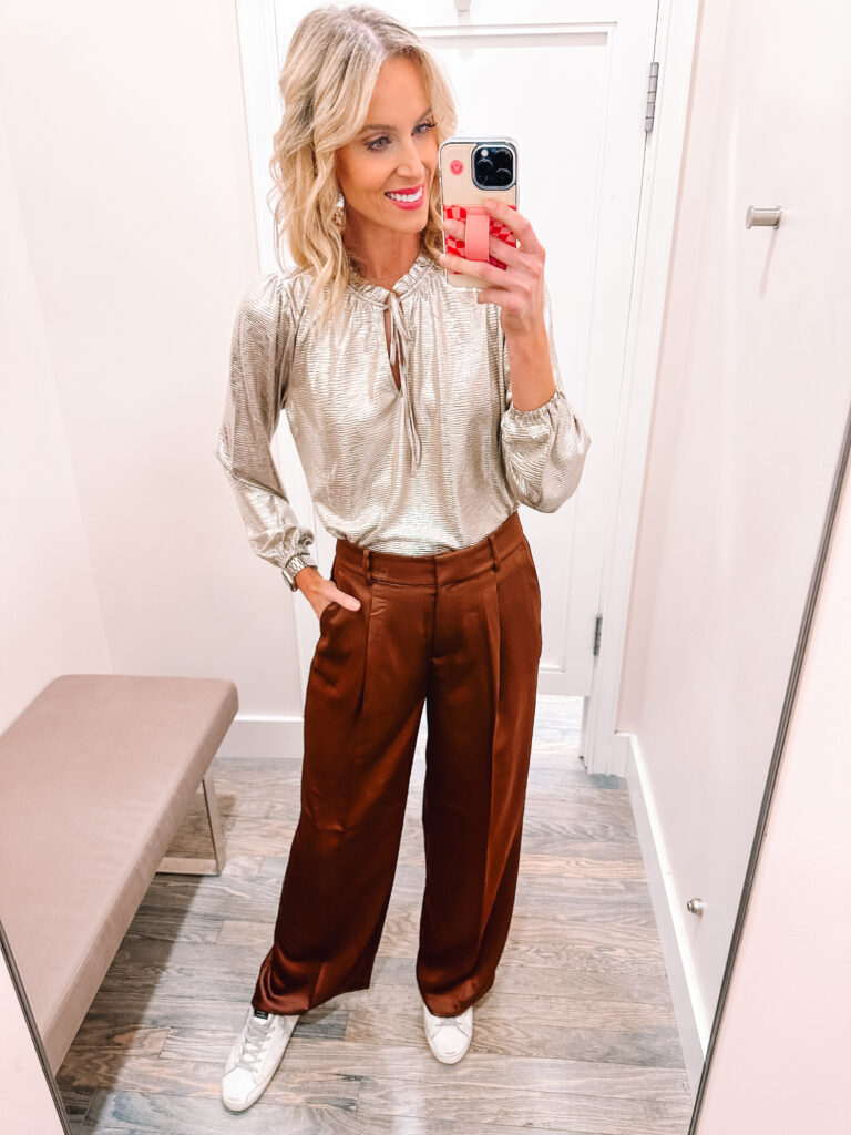 I am sharing a HUGE LOFT holiday outfit idea try on with 13 outfits you can wear for Thanksgiving, Christmas, or NYE! Try this metallic blouse and satin pants for any of the three holidays!