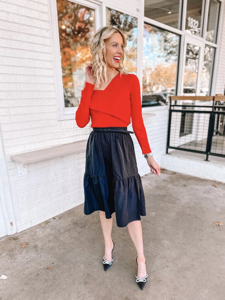 You'll love this Walmart holiday outfit idea! An affordable but gorgeous black skirt with an off the shoulder red top!