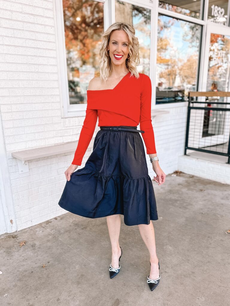 You'll love this Walmart holiday outfit idea! An affordable but gorgeous black skirt with an off the shoulder red top!