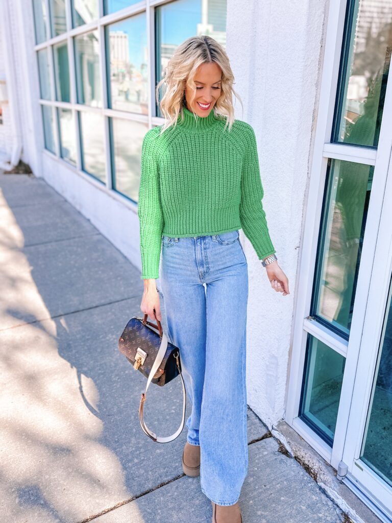 Pair your wide leg jeans with a sweater and UGGs for a cool winter outfit. 