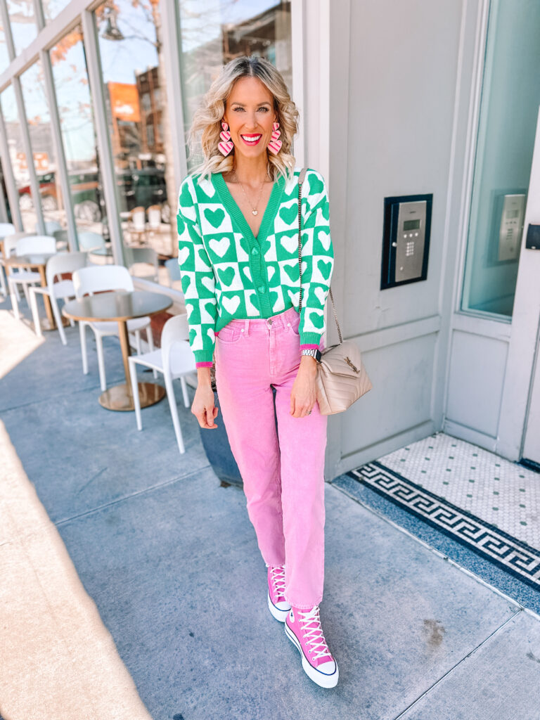Love color but not sure what to do with it? I'm sharing 10 examples of how to wear colored pants and jeans. You'll be a pro in no time! I love these pink jeans with the heart sweater! 