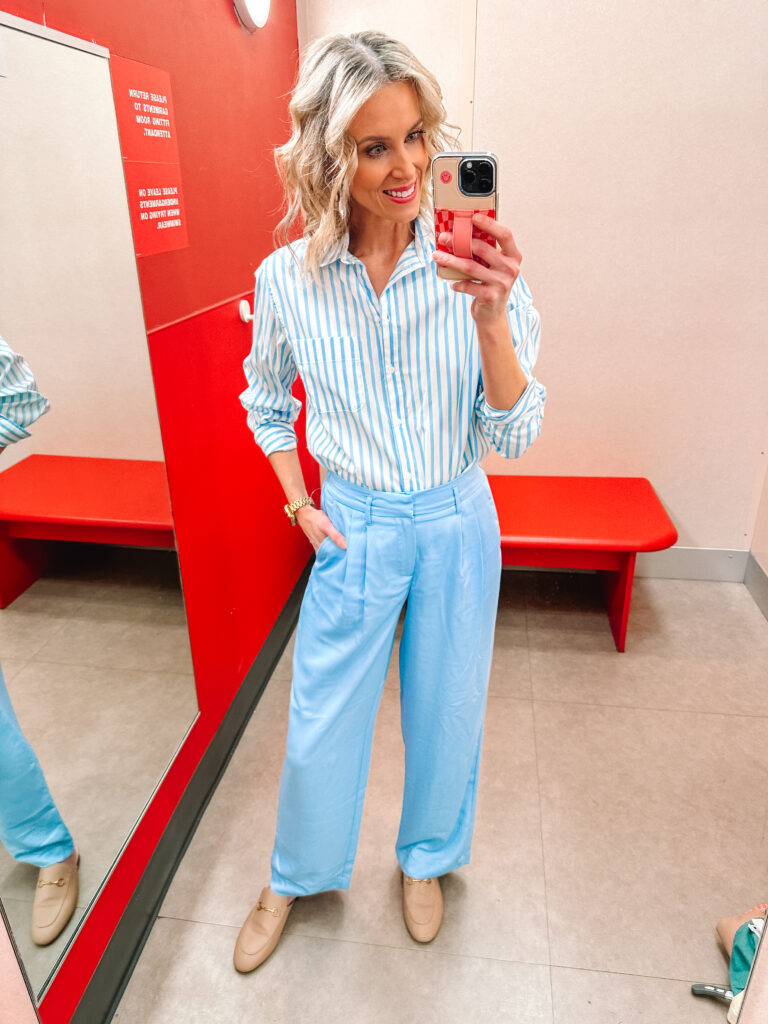 I am SO excited to share this HUGE spring Target try on haul. I am talking 13 affordable outfits with mix and match pieces to keep you stylish all season! You'll love these blue trousers and matching striped top. 