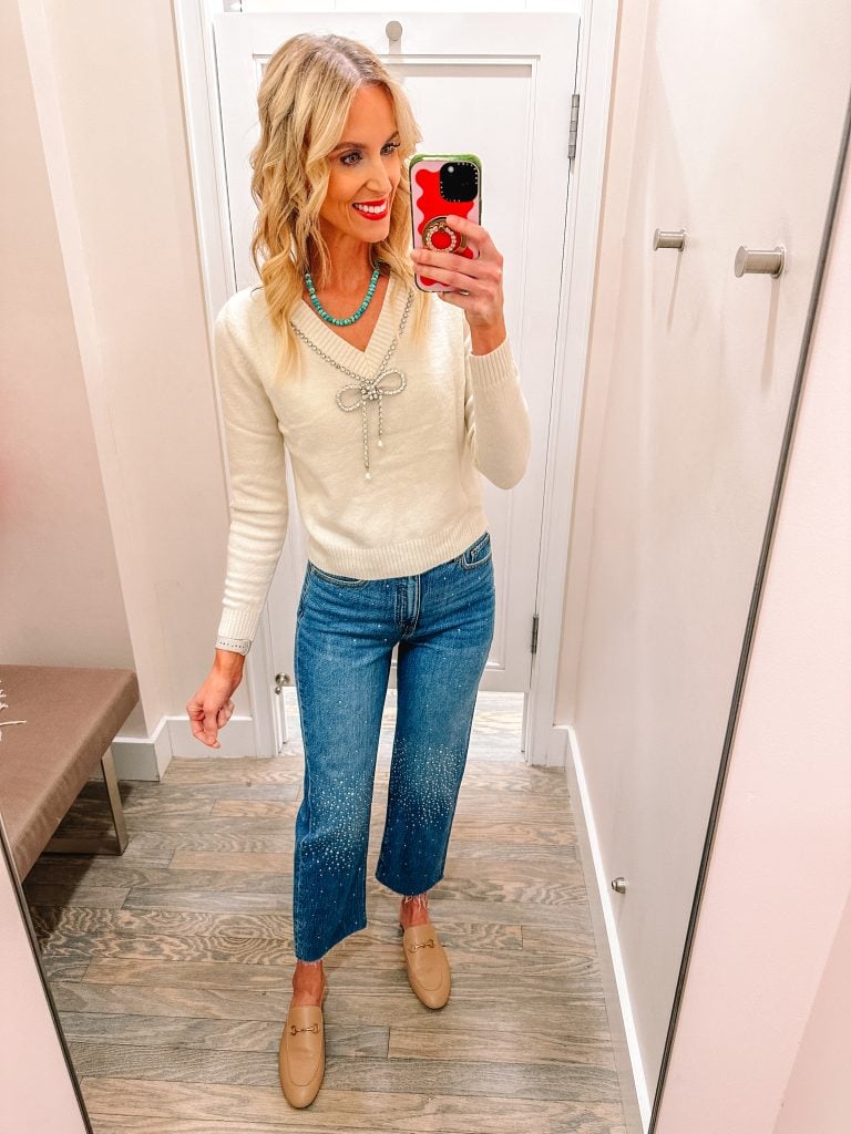 I have a HUGE LOFT try on haul for you with ELEVEN outfit ideas complete with holiday outfit ideas and winter outfits. From dressy to casual, festive and fun, I have it all! Pair this bow sweater with these shimmer jeans!